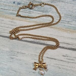 Avon small bow Pendant Necklace.